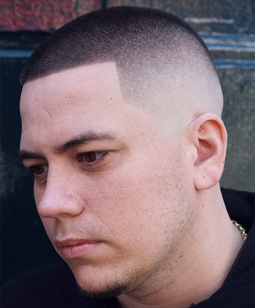Skin Fade - Professional buzz cut style guide featuring skin fade with Top: 6-12mm, Sides: 0mm length